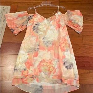 V-Neck dress with fanned sleeves.